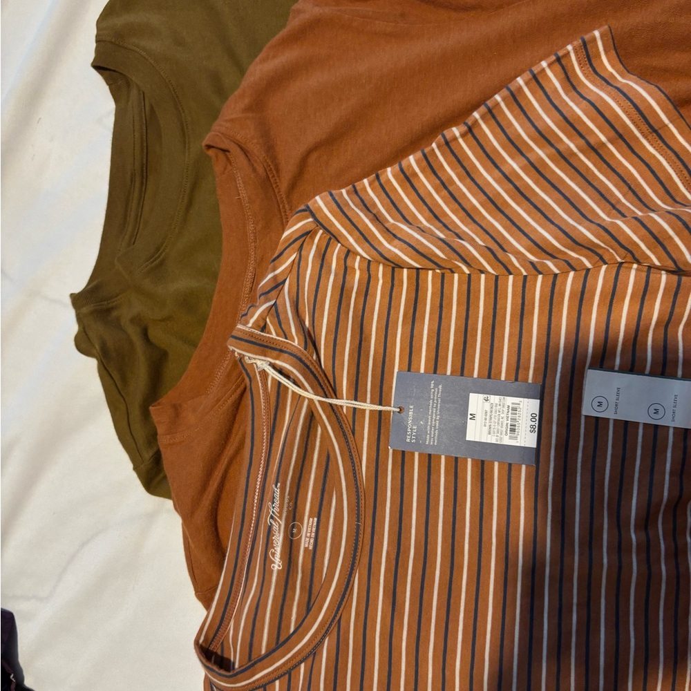 a new day and universal thread shirts